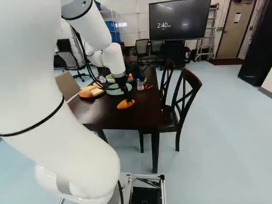 Right scene camera at the same recorded timestamp, showing the robot arm's reach across the table from the opposite side.